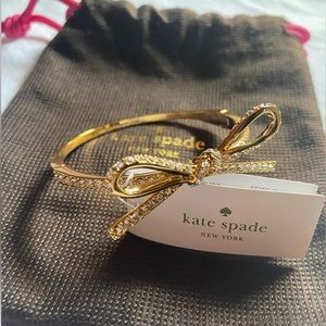 NWT Kate Spade golden bow shimmering bracelet with signature dust bag!